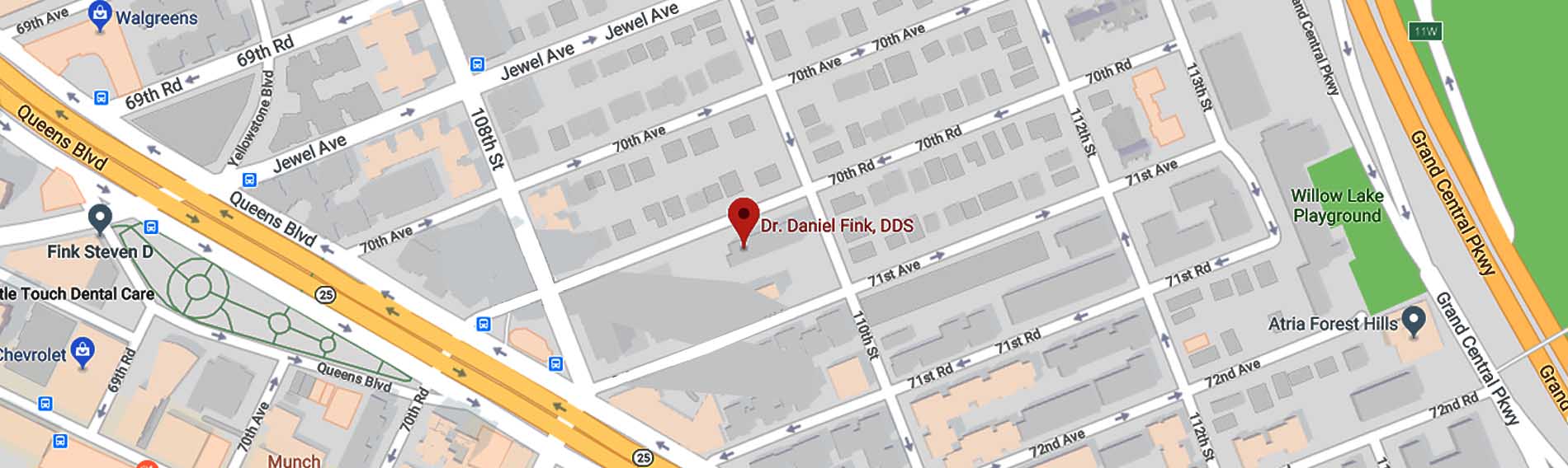 The image shows a street view with a map and a red pin marking a specific location within an urban area, featuring a building and a sign with text, set against a backdrop of cityscape and infrastructure.